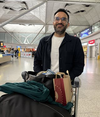 Fazal Chowdhury at London Stansted Airport following his return to the UK on the Government’s first charter flight (Paul Marriott/PA)